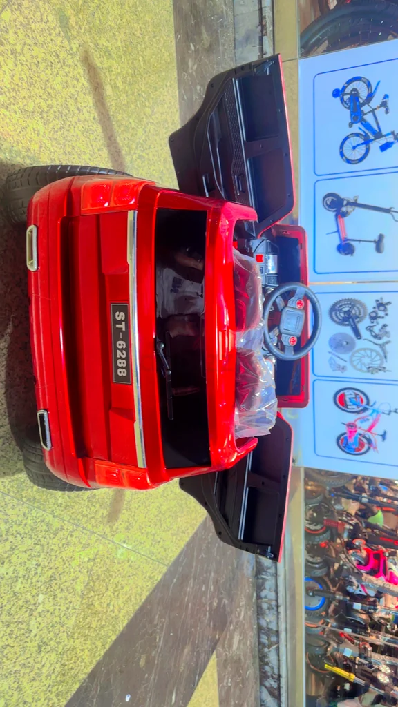 Children trying car with remote control63227807169027114