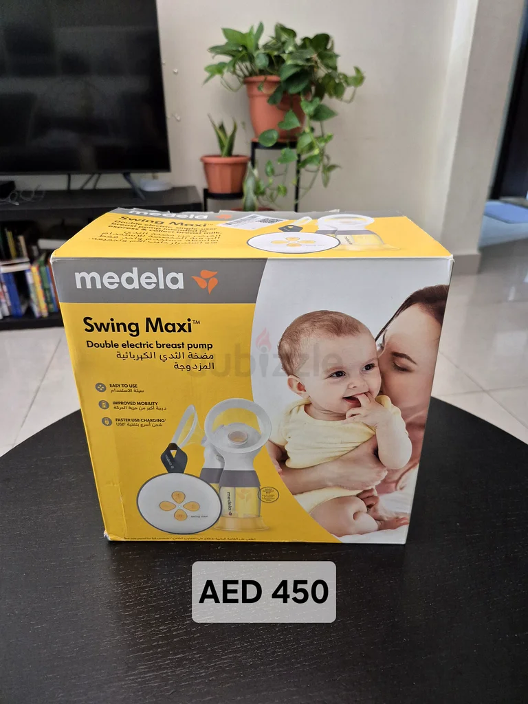 Medela Swing Maxi Double Electric Breast Pump - Free bottles and breast pads63233645906306114