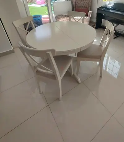IKEA extendable dining table with 4 chairs is available