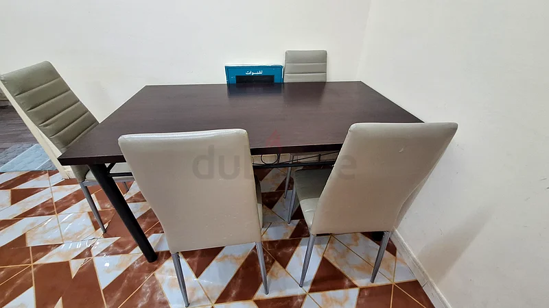 Selling our Stylish Brown Dining table and beige color Chairs4 SeaterDM for more details63179389010691113