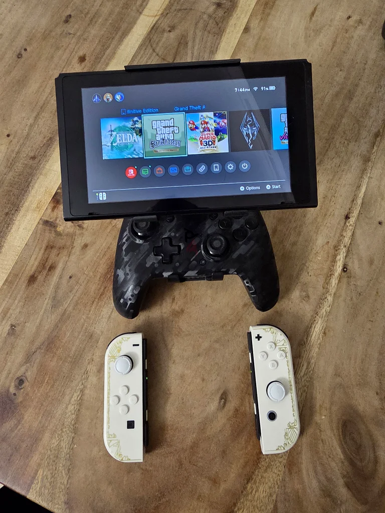 نينتندو سويتش + وحدات تحكم جوي كونز بتصميم ذيلدا + وحدة تحكم احترافية + قبضة لوحدة التحكم63206884012801113