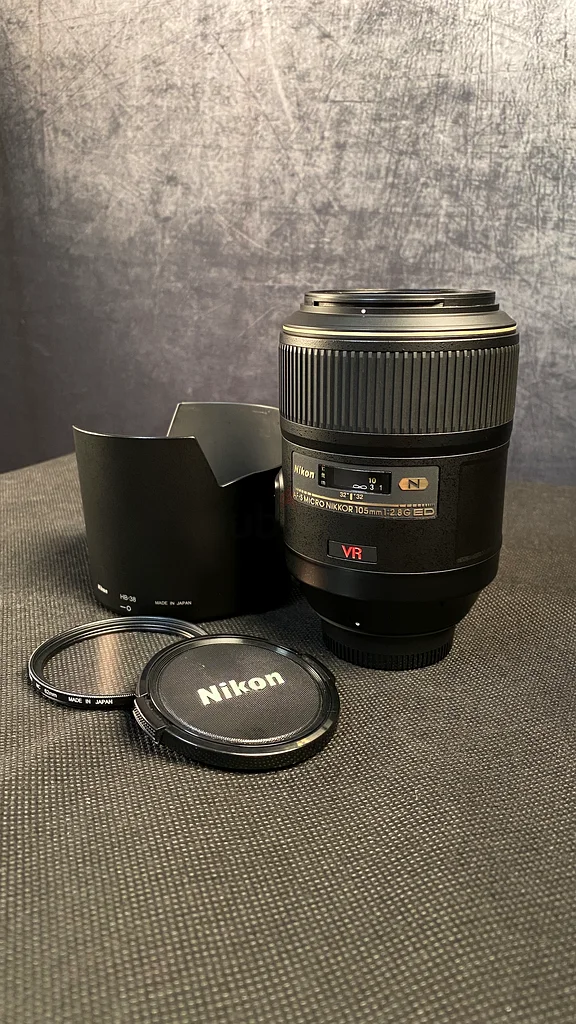 Micro Nikkor
105mm  f/2.8
Nikon Hood HB-38
Nikon lens filter 
All made in Japan63173508983810111