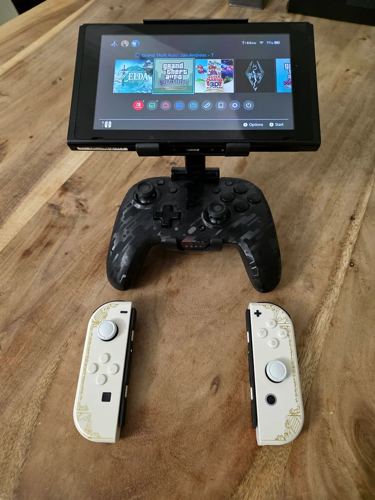 نينتندو سويتش + وحدات تحكم جوي كونز بتصميم ذيلدا + وحدة تحكم احترافية + قبضة لوحدة التحكم63206884012801114