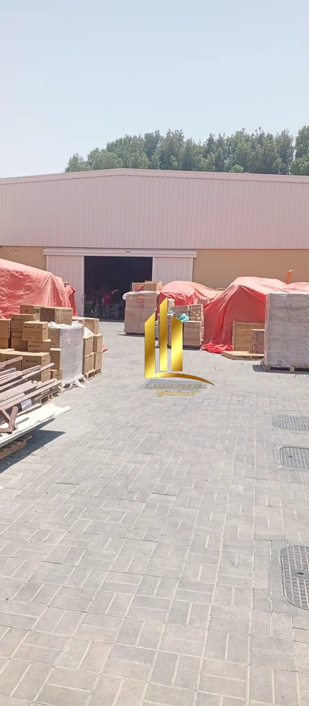 Investment property for sale in Al Sajaa Industrial area, consisting of a yard + a large warehouse + 2 shops in the front. The property is only two mo63195059689730112