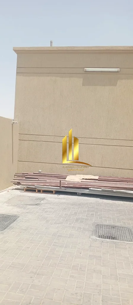 Investment property for sale in Al Sajaa Industrial area, consisting of a yard + a large warehouse + 2 shops in the front. The property is only two mo63195059689730114