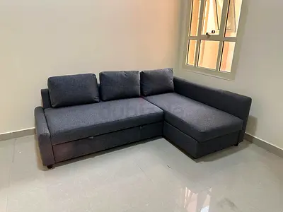 L-Shaped sofa com bed with storage