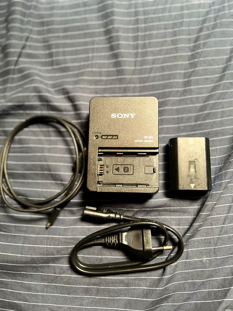 Unused Sony charger for camera battery with spare battery