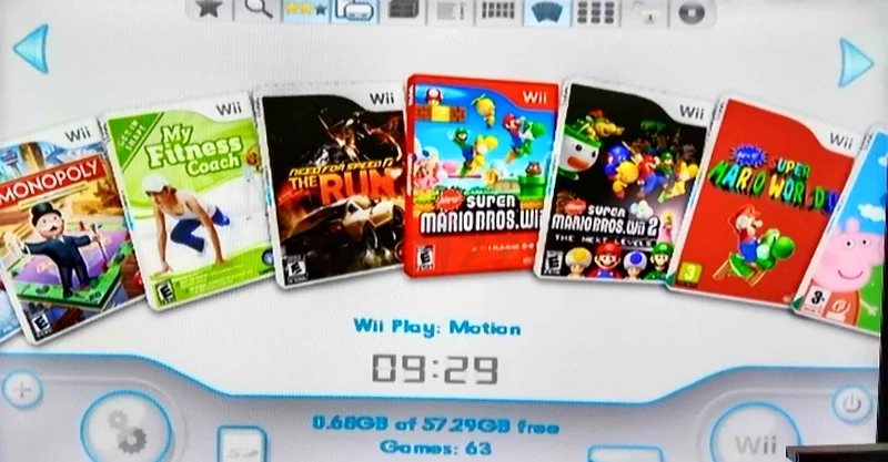 Nintendo Wii with Fit board and 2 controllers + 30 games.63204868566147113