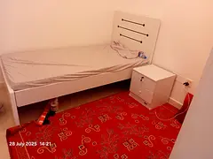 Small room with shared washroom available for one working female bachelor