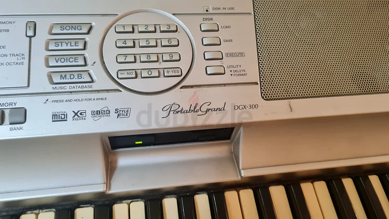 Yamaha DGX300 semiweighted 76 key piano with
Wooden stand and sustain pedal. 
Keys little yellowish.63209350994050114