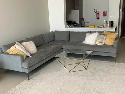 Stylish West Elm Grey L-Shaped Sofa with Elegant Accents