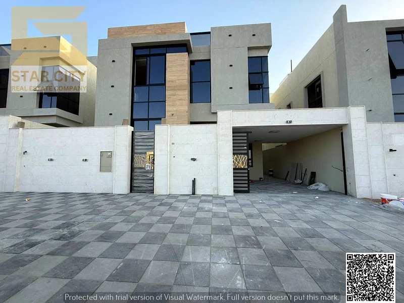 Villa for sale in Ajman, Al Bahia area: Majlis, 2 halls, 5 master bedrooms, maid's room, and garden - freehold - no down payment63883087733505110