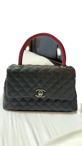 Black Chanel bag with red handle