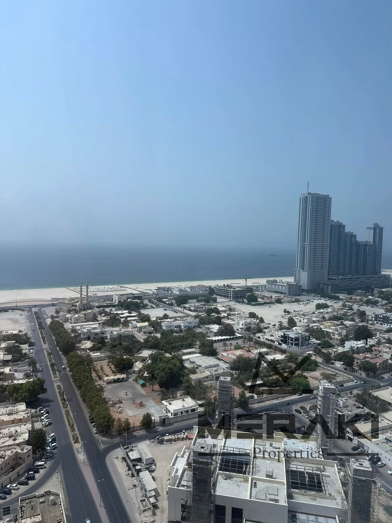The best model in Ajman, with a completely open view of the sea and the city, 3 rooms and a hall with a maid’s room, large area, high floor63866308084354110