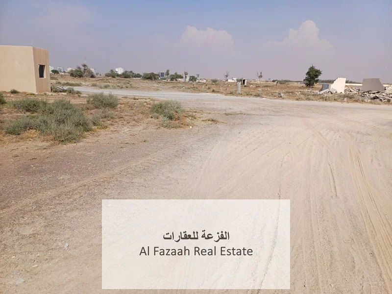 For sale in Sharjah, Al Qasimia City, Nizwa, vacant land, area 11,948 square feet, industrial permit, freehold warehouses for all nationalities, excel63821147173762114