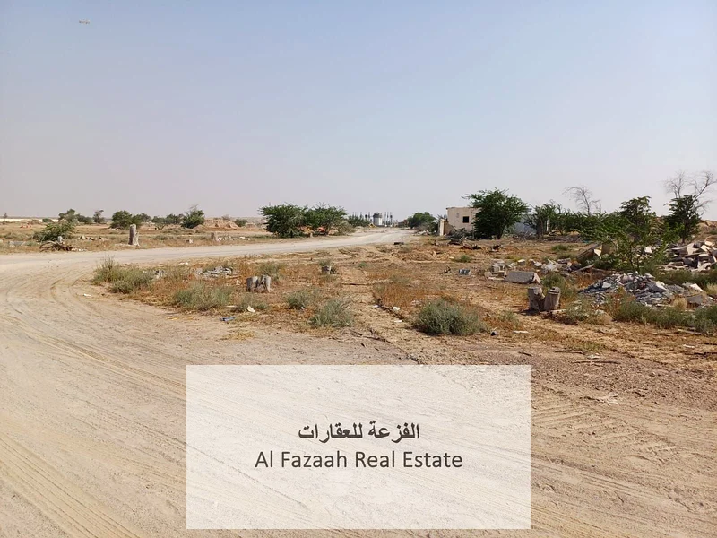 For sale in Sharjah, Al Qasimia City, Nizwa, vacant land, area 11,948 square feet, industrial permit, freehold warehouses for all nationalities, excel63821147173762113
