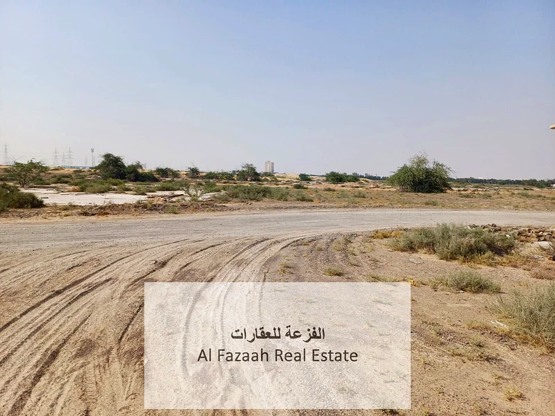 For sale in Sharjah, Al Qasimia City, Nizwa, vacant land, area 11,948 square feet, industrial permit, freehold warehouses for all nationalities, excel63821147173762112