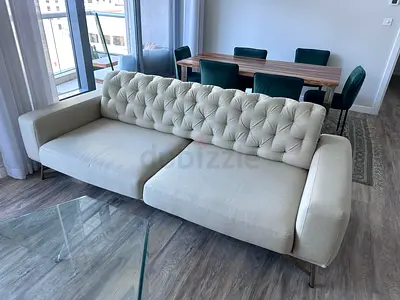 Stylish Beige Tufted Sofa with Contemporary Design