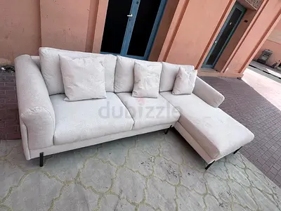 Stylish L-Shaped Sofa with Cushions for Comfortable Living Spaces