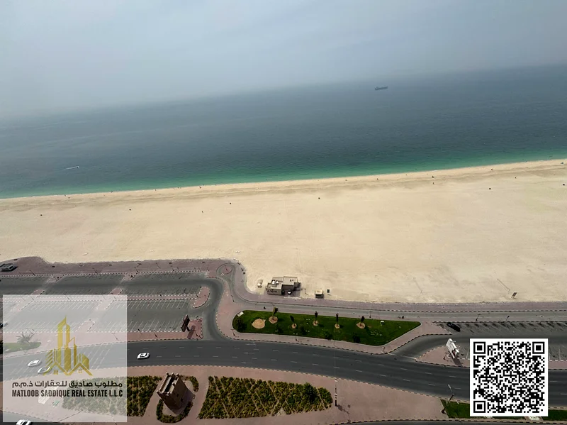 شقة فاخرة بغرفتي نوم ومطبخ مفتوح وإطلالة جزئية على البحر63871086642947113
