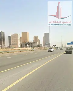 Land for sale in Al Alia area - excellent location on a main street - overlooking Sheikh Mohammed bi