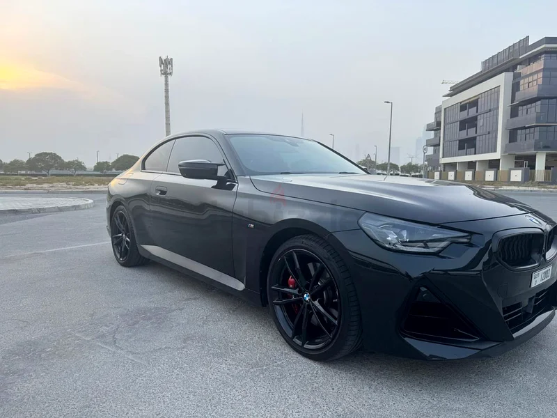 BMW M240i with black package, and unique black/blue interior, upgraded spoiler and exhaust tip.63410194617217112