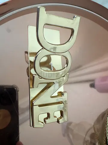 Shiny gold paper clip from 2XL