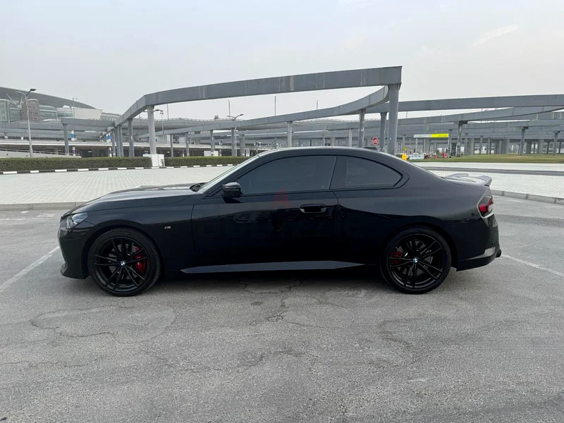 BMW M240i with black package, and unique black/blue interior, upgraded spoiler and exhaust tip.63410194617217114