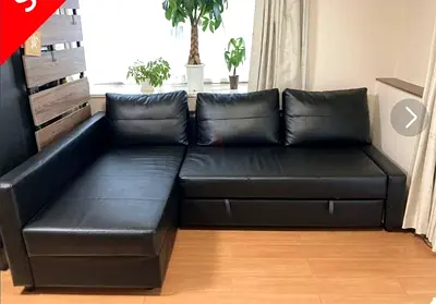 Black leather sofa bed