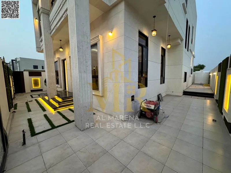 A villa with a price including registration and ownership fees on the main street, ready for occupancy in the most upscale areas of Ajman, freehold fo63893559650179111