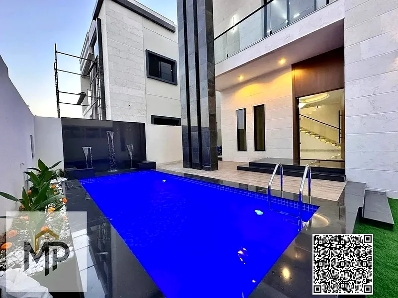 For sale - a luxury villa with a swimming pool in a prime location in Ajman, high-end finishing, modern design, including registration and owners63894218723971114