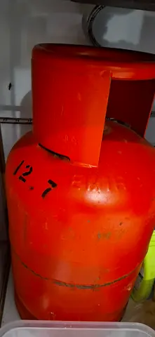 Red Gas Cylinder with a regulator for Sale - Perfect for Your Cooking Needs!