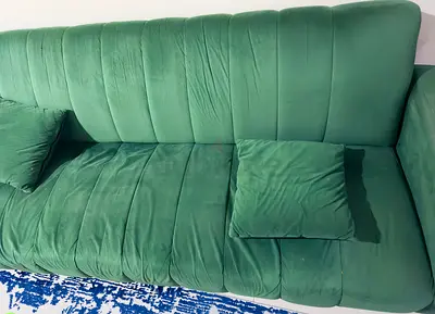 Elegant Green Velvet Sofa with Cushions