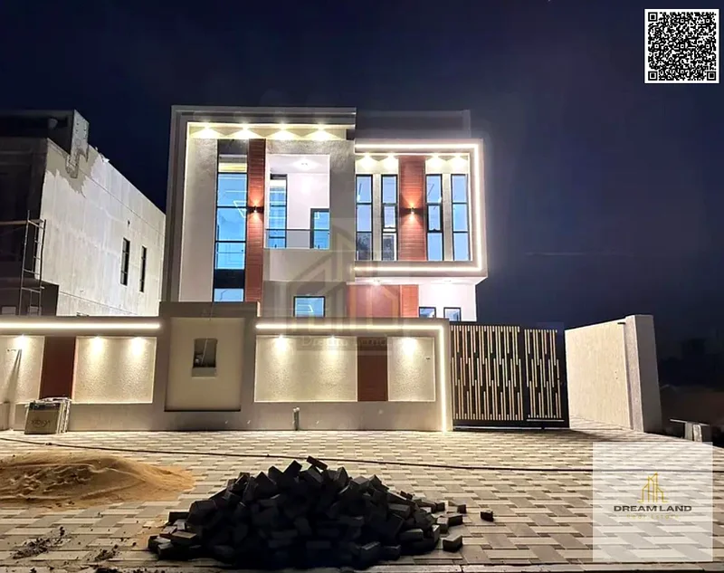 For sale, a villa consisting of 4 master bedrooms, a living room, and 2 halls, including registration fees, in Ajman, Al Helio 2 area63891458485379110