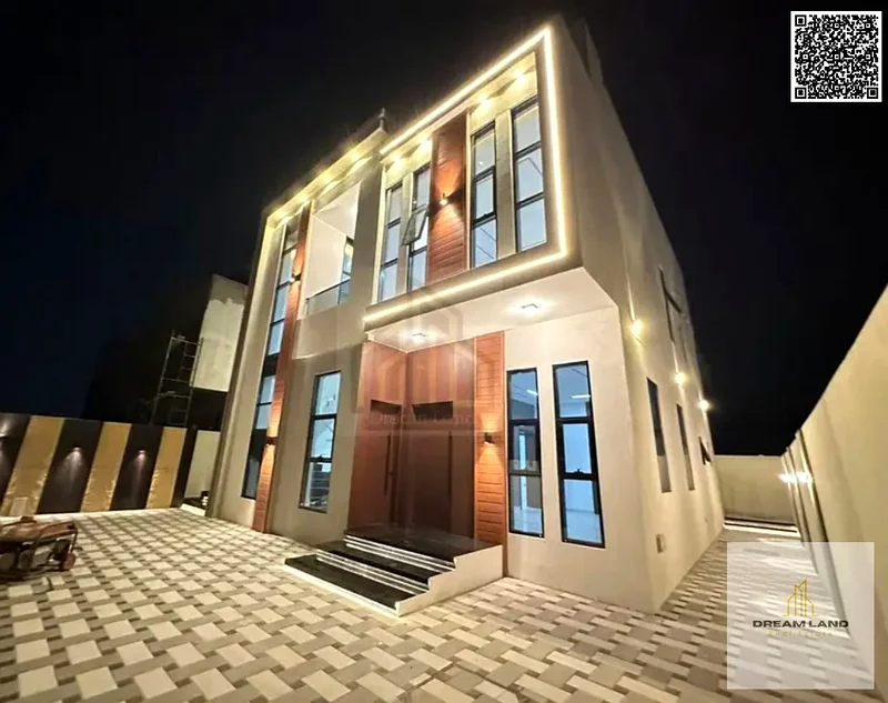 For sale, a villa consisting of 4 master bedrooms, a living room, and 2 halls, including registration fees, in Ajman, Al Helio 2 area63891458485379111