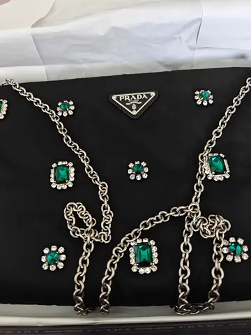 Elegant Prada Handbag with Stunning Emerald Accents