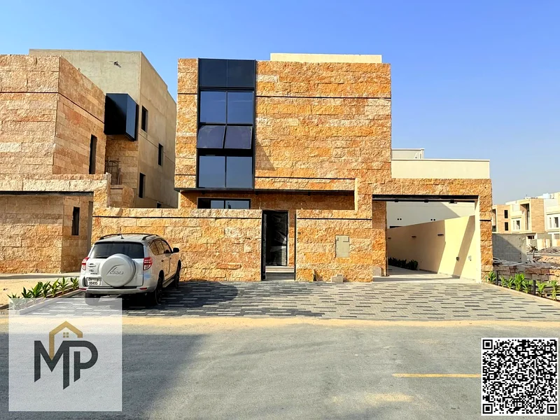 Villa for sale - two floors and a large courtyard - close to Sheikh Mohammed bin Zayed Road - freehold for all nationalities for life -63880618977155111