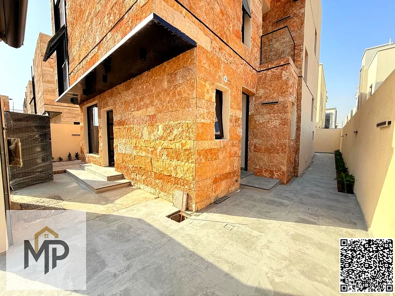 Villa for sale - two floors and a large courtyard - close to Sheikh Mohammed bin Zayed Road - freehold for all nationalities for life -63880618977155113