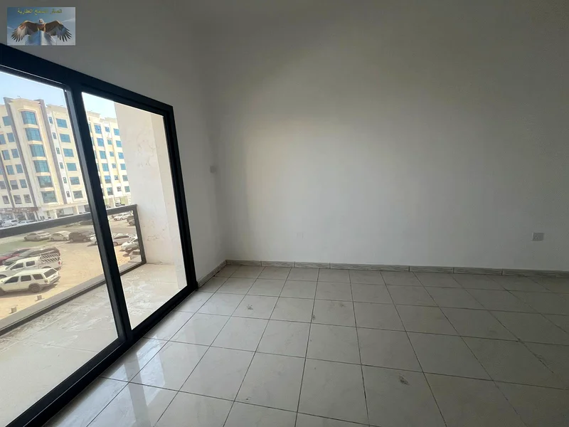 1BR & hall apartment for rent in Al Rawda 3, Ajman, first-time occupancy, 2 bathrooms, 2 spacious balconies, equipped with split AC, near Emirates Bea63719604294275112