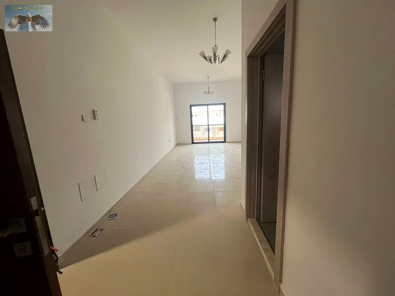 1BR & hall apartment for rent in Al Rawda 3, Ajman, first-time occupancy, 2 bathrooms, 2 spacious balconies, equipped with split AC, near Emirates Bea63719604294275110