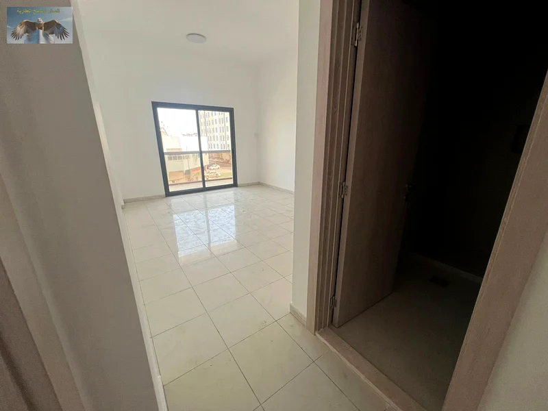 1BR & hall apartment for rent in Al Rawda 3, Ajman, first-time occupancy, 2 bathrooms, 2 spacious balconies, equipped with split AC, near Emirates Bea63719604294275113