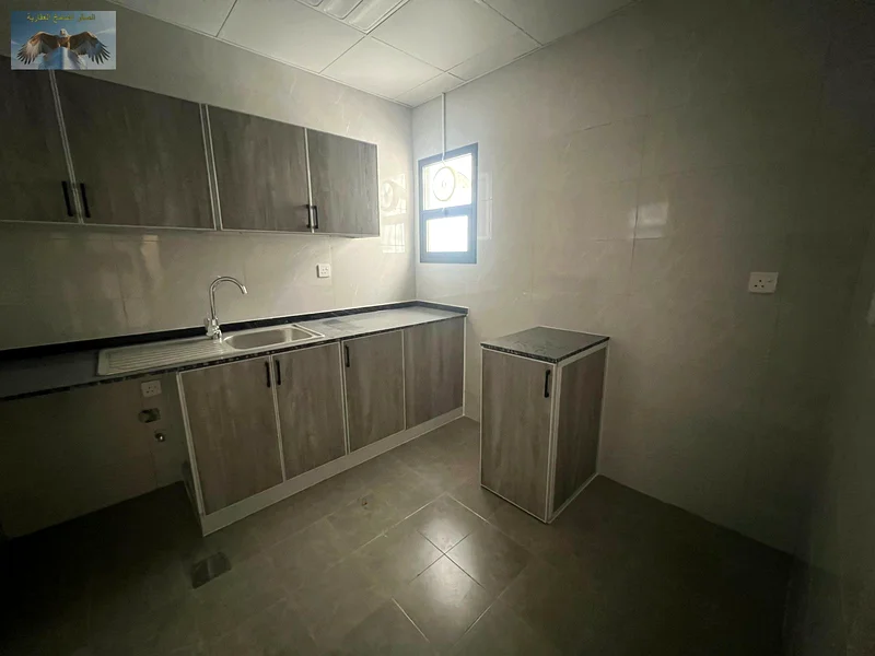 1BR & hall apartment for rent in Al Rawda 3, Ajman, first-time occupancy, 2 bathrooms, 2 spacious balconies, equipped with split AC, near Emirates Bea63719604294275114