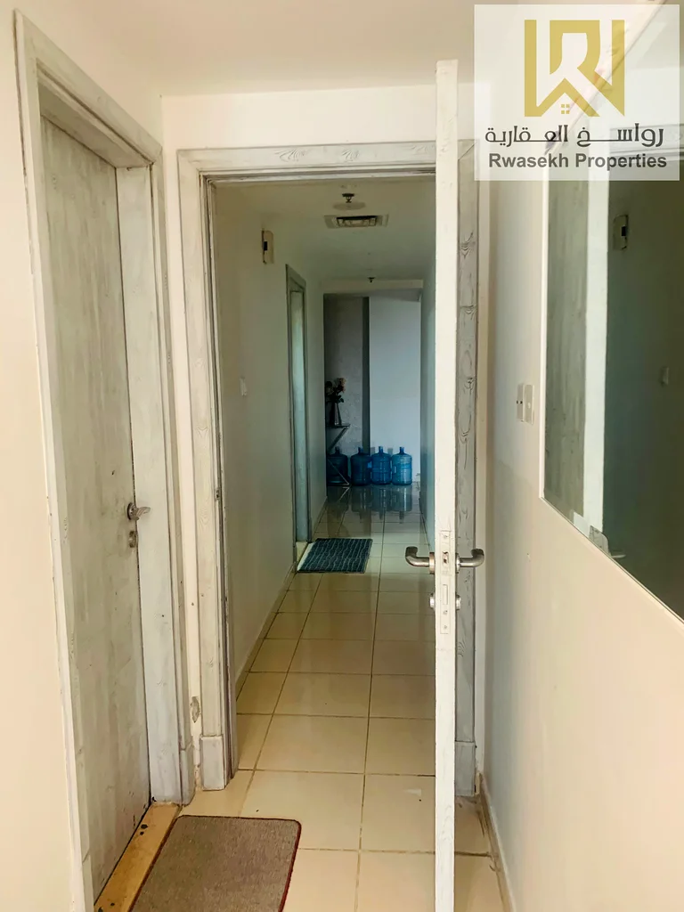 Real estate investment opportunity in Orient Towers, Ajman - 2 bedroom and hall apartment for sale with easy monthly installment plan.63866727827714113