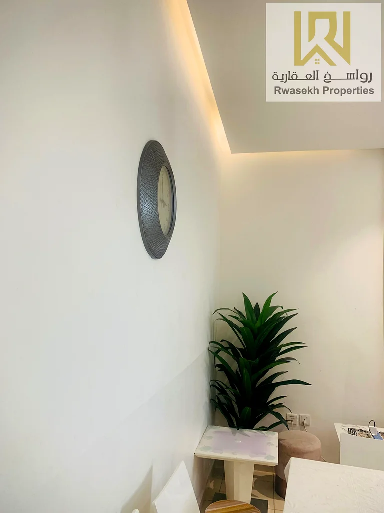 Real estate investment opportunity in Orient Towers, Ajman - 2 bedroom and hall apartment for sale with easy monthly installment plan.63866727827714114