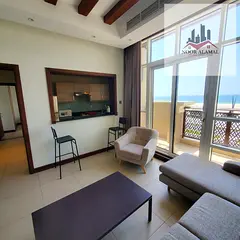 Sharjah - alriffa- alheera beach - one bedroom apartment with a living room, kitchen, and two bathro