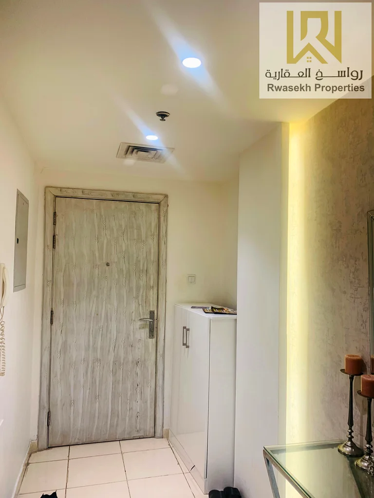 Real estate investment opportunity in Orient Towers, Ajman - 2 bedroom and hall apartment for sale with easy monthly installment plan.63866727827714111