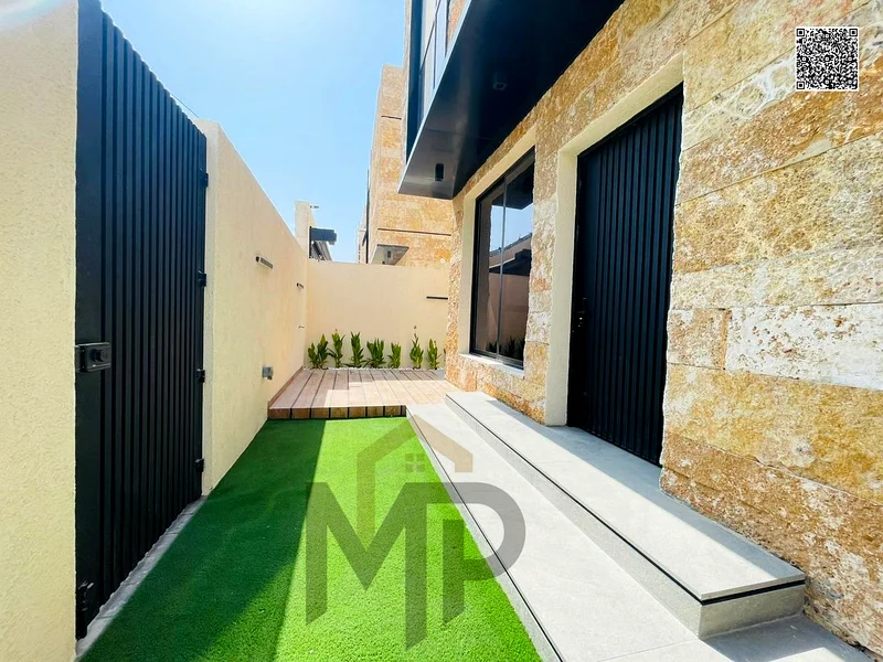 Villa for sale - two floors and a large courtyard - close to Sheikh Mohammed bin Zayed Road - freehold for all nationalities for life -63880619864195113