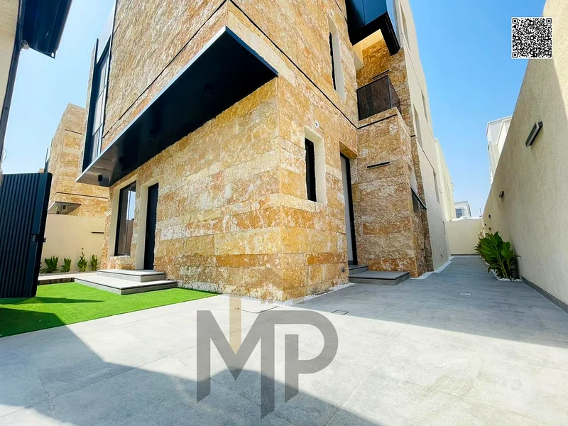 Villa for sale - two floors and a large courtyard - close to Sheikh Mohammed bin Zayed Road - freehold for all nationalities for life -63880619864195112