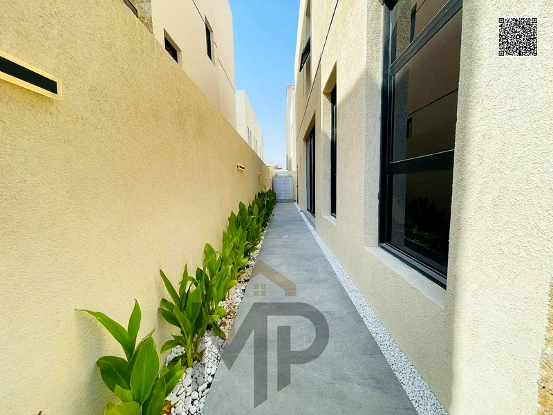 Villa for sale - two floors and a large courtyard - close to Sheikh Mohammed bin Zayed Road - freehold for all nationalities for life -63880619864195114