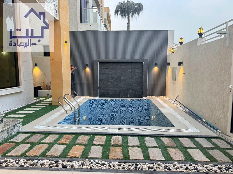 Villa for sale in Ajman, Al Helio 2 area, including electricity, water, and air conditioning63898332518658114